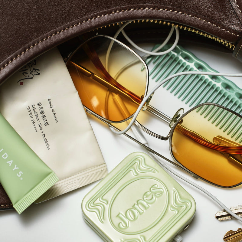 jones tin spilling out of purse