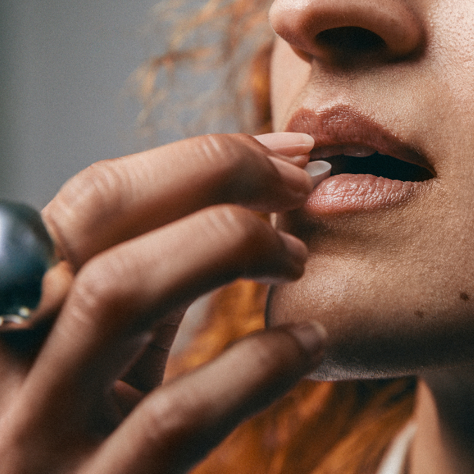 woman taking nicotine replacement therapy