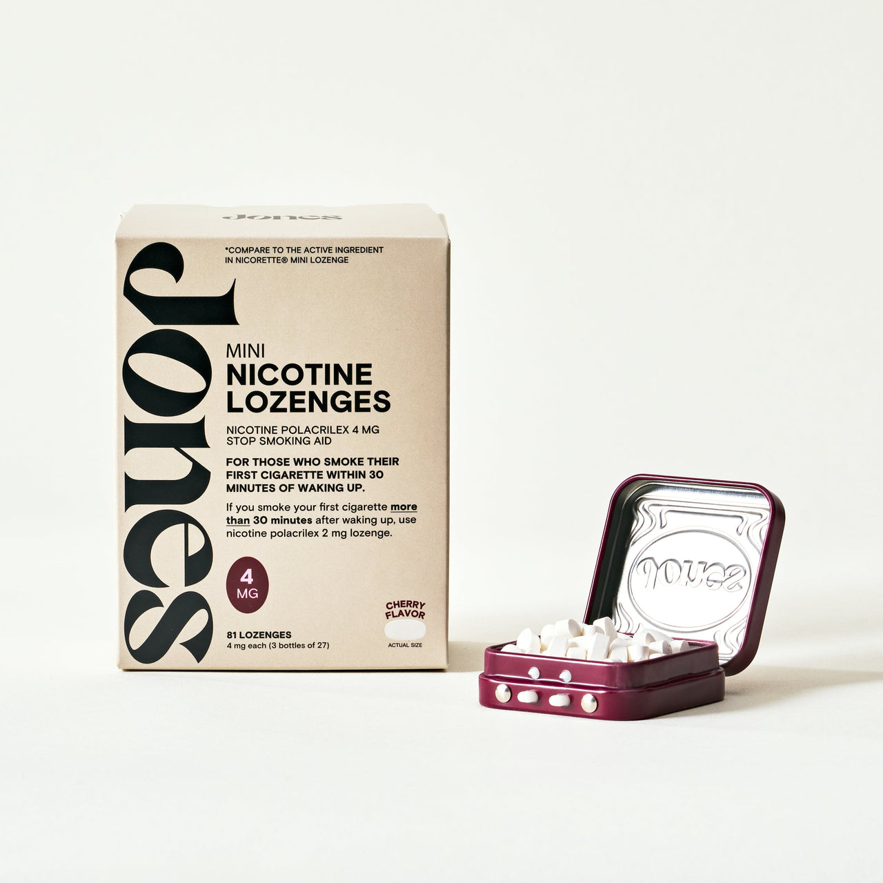 A box labeled "Nicotine Mints" by Quit with Jones stands next to an open metal tin of small white mint lozenges. The FDA-approved packaging shows 4 mg strength and promotes their role in nicotine replacement therapy.