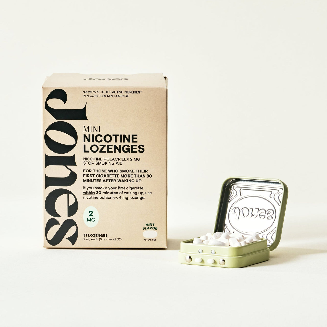 A hand holding a small square metal tin with embellishments labeled Jones that contains FDA-approved Jones nicotine replacement therapy lozenges and a cell phone screen showing an app to quit vaping by Jones with money saved, streak, and daily nicotine tracking.