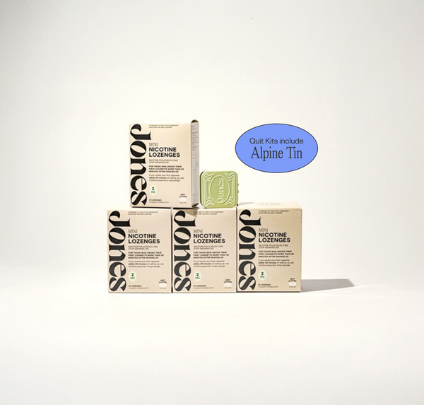 Two tan-colored Jones Sampler boxes are shown—one upright with a green lozenge container on top, the other leaning beside it. Text highlights the Jones brand name, 2mg nicotine mints, and mint flavor.