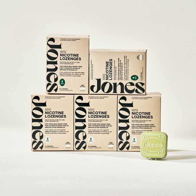 Two tan-colored Jones Sampler boxes are shown—one upright with a green lozenge container on top, the other leaning beside it. Text highlights the Jones brand name, 2mg nicotine mints, and mint flavor.