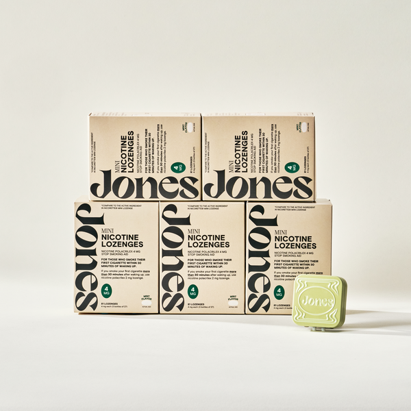 Four boxes of Jones (OLD) Switcher Upper lozenges are stacked, with one tin on top. Each box features bold black branding and product details, making them perfect for cravings support.