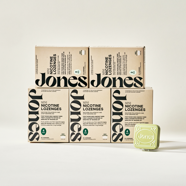 Two tan-colored Jones Sampler boxes are shown—one upright with a green lozenge container on top, the other leaning beside it. Text highlights the Jones brand name, 2mg nicotine mints, and mint flavor.