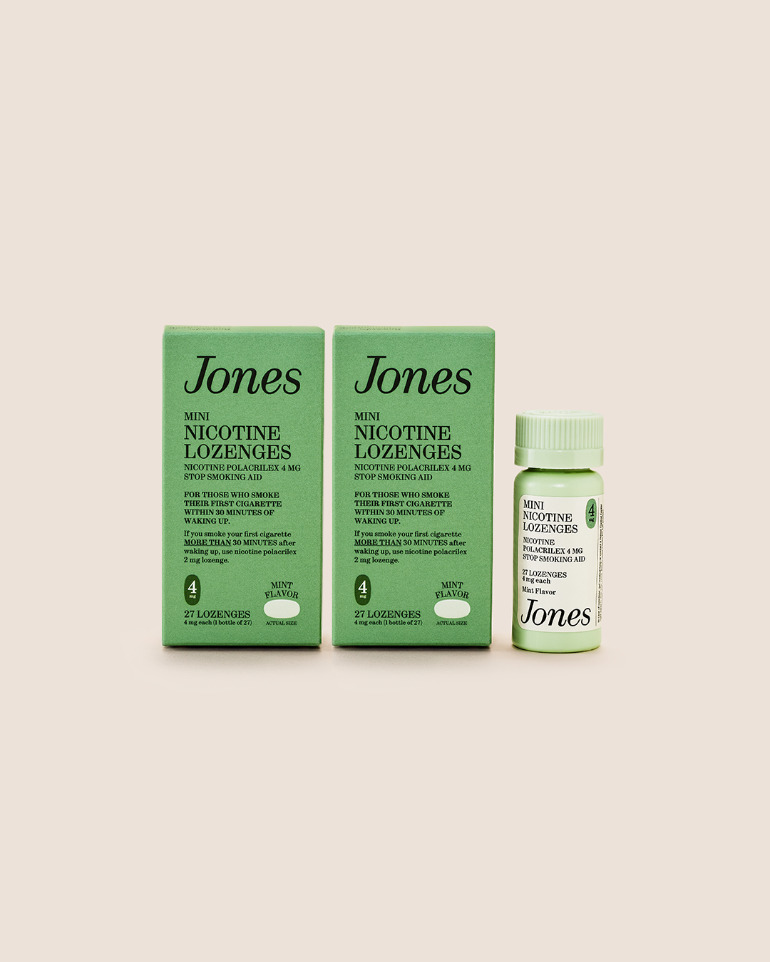 Two green Quit with Jones Kickstart Kit boxes and one matching bottle are arranged side by side on a beige background. The product labels display black text highlighting the mint flavor and usage information, along with icons for dosage and lozenge count on each box. As part of your quitting essentials, the Kickstart Kit from Quit with Jones offers effective behavioral support to help you stay on track.