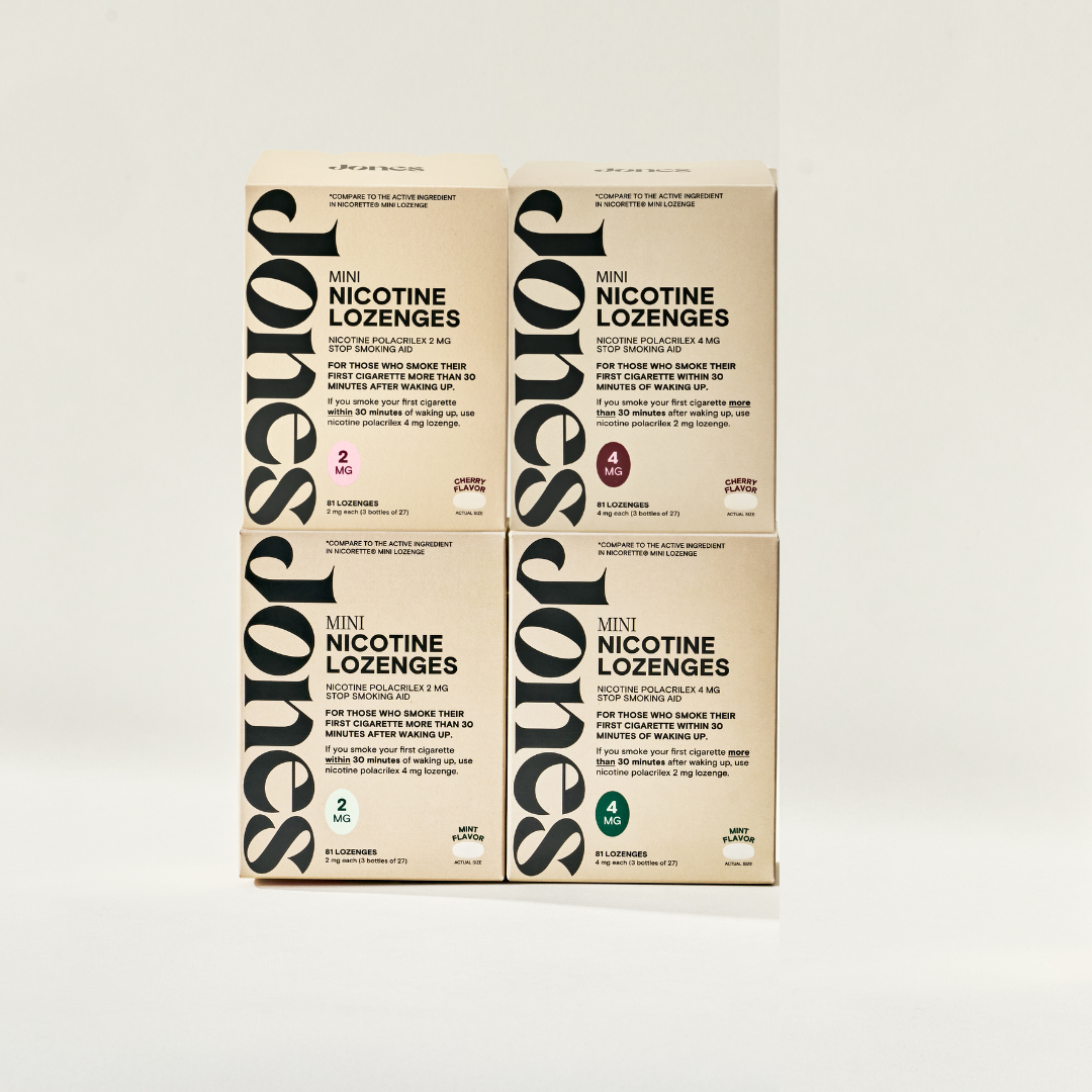 Four beige boxes of Jones Sampler by Jones are stacked in a 2x2 grid. Each box displays bold black text and colored circles indicating "2mg Mint" and "4mg Mint" lozenges—perfect for those seeking support to quit vaping.