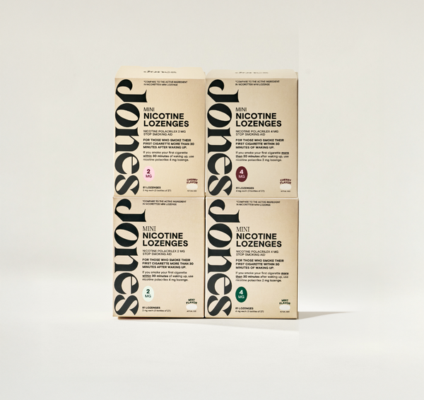 Four beige boxes of Jones The Sampler Mini Nicotine Lozenges are arranged in a square. FDA-approved, each features “Jones” vertically in black letters and nicotine strength icons—ideal support for quitting smoking.